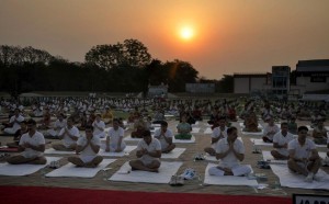 People practise yoga at a session to mark the International Yoga Day in Gurgaon on June 21, 2015