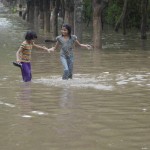 People walk during rains in Gurgaon on June 14, 2015