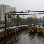 Suburban trains at a station after their services were suspended during heavy rains in Mumbai on June 19, 2015