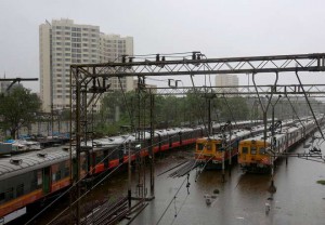 Suburban trains at a station after their services were suspended during heavy rains in Mumbai on June 19, 2015