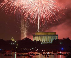 Fireworks explode over the Lincoln Memorial, the Washington Monument and the US Capitol in celebration of Independence Day in Washington, DC on July 4, 2015.