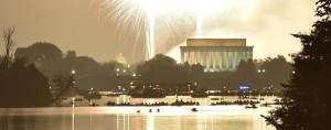 Fireworks illuminate the night sky and Reflecting Pool before the Lincoln Memorial, Washington Monument and US Capitol in celebration of Independence Day in Washington, DC on July 4, 2015.