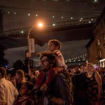 People watch the Macy's Fourth of July Fireworks from outside Brooklyn Bridge Park on July 4, 2015 in the Brooklyn borough of New York City. The celebrations mark the nation's 239th Independence Day.