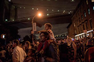 People watch the Macy's Fourth of July Fireworks from outside Brooklyn Bridge Park on July 4, 2015 in the Brooklyn borough of New York City. The celebrations mark the nation's 239th Independence Day.