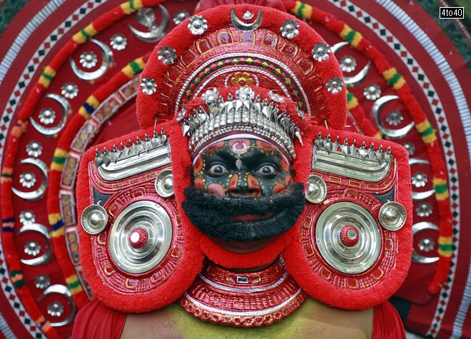 A dancer waits to perform during festivities marking the start of the annual harvest festival of Onam’ in Kochi on August 19, 2015