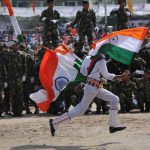 A student running during the Independence Day function at Mini Stadium parade ground in Jammu