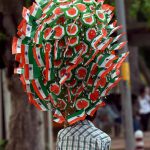 A vendor carries Tricolours on the occasion of 70th Independence Day in New Delhi