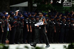 An Armyman carries the national flag during a ceremony for former President APJ Abdul Kalam outside his house in New Delhi on July 28, 2015.