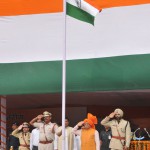 Chief Minister Manohar Lal Khattar hoisting the National Flag during the state-level Independence Day function at Dronacharya Stadium in Kurukshetra