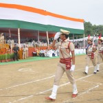 Chief Minister Manohar Lal Khattar taking salute from a marching contingent during the state-level Independence Day function at Dronacharya Stadium in Kurukshetra