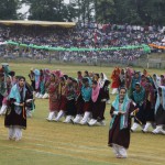 College girls perform a traditional dance during the Independence Day celebrations at Bakshi Stadium in Srinagar