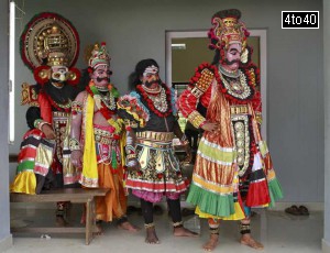 Dancers in traditional attires wait to take part in a performance during festivities marking the start of the annual harvest festival of ‘Onam’ in Kochi on August 19, 2015