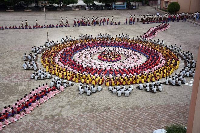 Gurukul School children celebrate Raksha Bandhan in their school in Surat on August 29, 2015