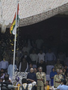 Jammu and Kashmir Chief Minister Mufti Mohammad Sayeed unfurls the National Flag during the Independence Day celebrations at Bakshi Stadium in Srinagar