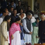 Jammu and Kashmir Chief Minister Mufti Mohammad Sayeed walks past former CM Omar Abdullah and PDP party president Mehbooba Mufti during the Independence Day celebrations at Bakshi Stadium in Srinagar