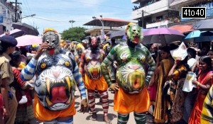 Men dressed to play Puli Kali in the Atham procession held in the old royal town of Thrippunithura during festivities marking the start of the annual harvest festival of ‘Onam’ in Kochi on August 19, 2015. The ten-day-long Hindu festival is celebrated annually in India's southern coastal state of Kerala to commemorate the return of King Mahabali to his beloved subjects.