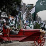 People celebrate the country's upcoming 69th Independence Day in Rawalpindi, Pakistan