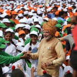 Prime Minister Narendra Modi (C) is greeted as he walks among schoolchildren after delivering his Independence Day speech from The Red Fort in New Delhi on August 15, 2015.