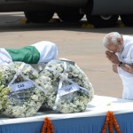 Prime Minister Narendra Modi pays his last respects at the body of former President APJ Abdul Kalam at Palam Air Force Station in New Delhi on July 28, 2015, after its arrival from Guwahati.