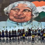School students hold up saplings at a programme to mark former president APJ Abdul Kalam’s 85th birth anniversary at Marina beach in Chennai on October 15, 2016.