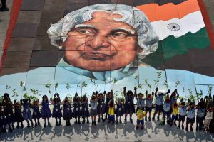 School students hold up saplings at a programme to mark former president APJ Abdul Kalam’s 85th birth anniversary at Marina beach in Chennai on October 15, 2016.