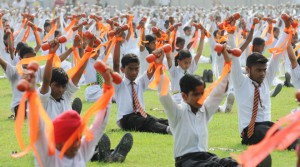 School students performing "Dumbbell" exercise during the 69th Independence Day function at Guru Nanak Stadium in Ludhiana