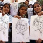 Students hold up sketches of former president APJ Abdul Kalam to mark his 85th birth anniversary at Scholar Fields Public School on October 15, 2016.