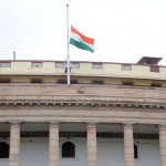 The national flag flies at half-mast at Parliament House in New Delhi to mourn former President APJ Abdul Kalam's demise in New Delhi on July 28, 2015.