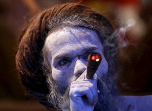 A Sadhu, or Hindu holy man, smokes inside his tent during the second ‘Shahi Snan’ (grand bath) at Kumbh Mela, or Pitcher Festival, in Trimbakeshwar on September 13, 2015