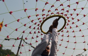 A Sikh woman displays her Gatka skills — a form of Sikh martial art — during a Nagar Kirtan, a religious procession, in New Delhi on November 24, 2015, on the eve of the birth anniversary of Guru Nanak Dev