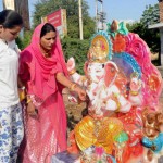 A girl and a woman purchase an idol of Lord Ganesha for the Ganesh festival in Jodhpur, Rajasthan, on September 15, 2015