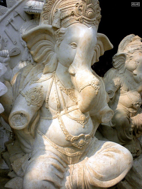 A plaster of paris statue getting ready for Ganesh Chaturthi Festival
