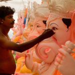 An artist giving touches to an idol of Lord Ganesh ahead of Ganesh festival in Jodhpur