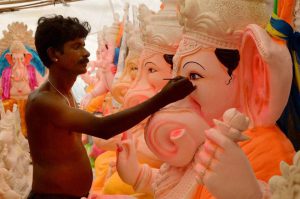 An artist giving touches to an idol of Lord Ganesh ahead of Ganesh festival in Jodhpur