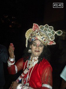 Artist dressed as Hindu God Krishna at Vidya Vihar Apartments, Rohini, on Janmashtami celebrations