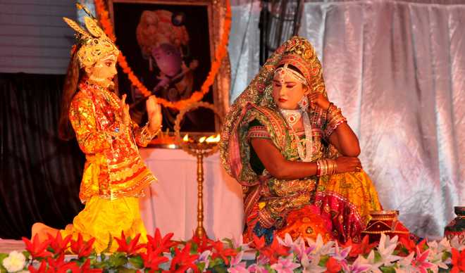 Artists perform Krishan Lila before Haryana Chief Minister Manohar Lal Khattar (not pictured) during a programme to mark Janmashtami in Karnal on September 5, 2015. Janmasthami marks the birth anniversary of Hindu Lord Krishna