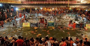 Sadhus or Hindu holy men arrive to take a holy dip in the waters of Godavari river during the second ‘Shahi Snan’ (grand bath) at the Kumbh Mela or Pitcher Festival in Nashik on September 13, 2015