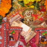 Bal Krishna idol is decorated in a cradle on occassion of Janmashtami