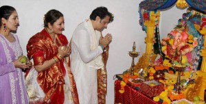 Bollywood actor Govinda and his family offer prayers to the elephant-headed Hindu god Lord Ganesh during the Ganesh festival in Mumbai on September 18, 2015