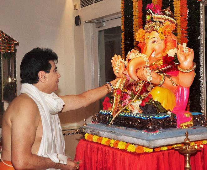 Bollywood actor Jeetendra offers prayers the elephant-headed Hindu god Lord Ganesh during the Ganesh festival in Mumbai on September 18, 2015