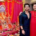Bollywood actor Neil Nitin Mukesh (left) and his father, singer Nitin Mukesh, during the Ganesh festival at their house in Mumbai on September 18, 2015