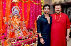 Bollywood actor Neil Nitin Mukesh (left) and his father, singer Nitin Mukesh, during the Ganesh festival at their house in Mumbai on September 18, 2015