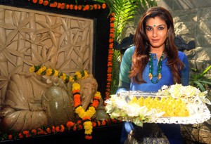 Bollywood actress Raveena Tondon poses for a photograph as she offers prayers to a statue of the elephant-headed Hindu god Lord Ganesh to mark the Hindu festival Ganesh Chaturthi in Mumbai on September 17, 2015