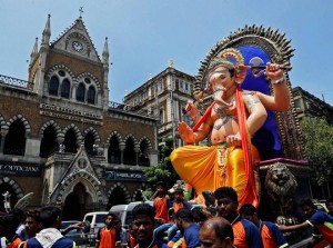 Devotees carry an idol of Lord Ganesha to a pandal for the upcoming Ganesh festival in Mumbai on September 14, 2015