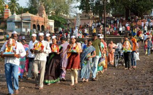 Devotees carry idols of Hindu elephant god Lord Ganesha for immersion into Krishna river