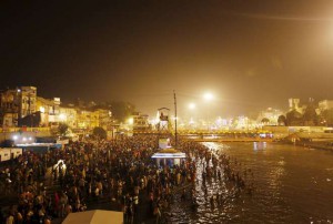 Hindu devotees take a holy dip in the waters of Godavari river during the second ‘Shahi Snan’ (grand bath) at the Kumbh Mela or Pitcher Festival in Nashik on September 13, 2015