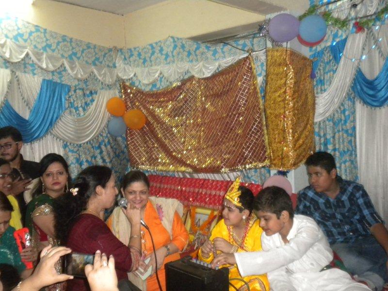 Ladies of Cosy Apartments singing a devotional song during Janmashtami celebrations