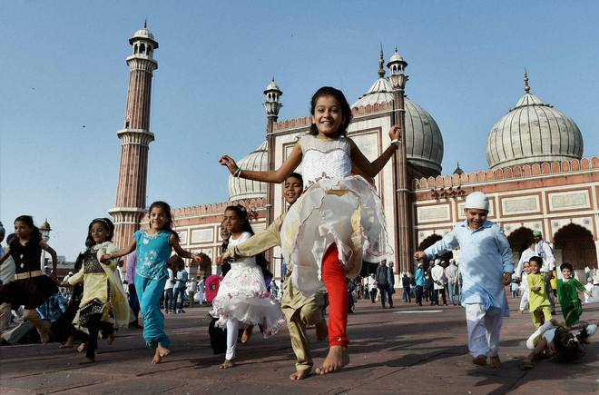 Muslim children play on Eid al-Adha at Jama Masjid in New Delhi on September 25, 2015