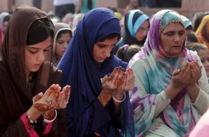 Muslim women perform their prayers at a mass prayer for Eid al-Adha at the Badshahi mosque in Lahore, Pakistan, on September 25, 2015