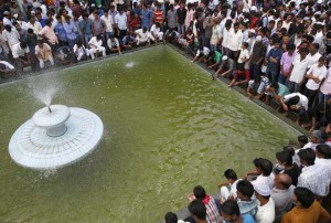 Nepali Muslims wash themselves upon their arrival for a mass prayer during the Eid al-Adha celebrations at the Kashmiri Takiya Jame mosque in Kathmandu, Nepal, on September 25, 2015